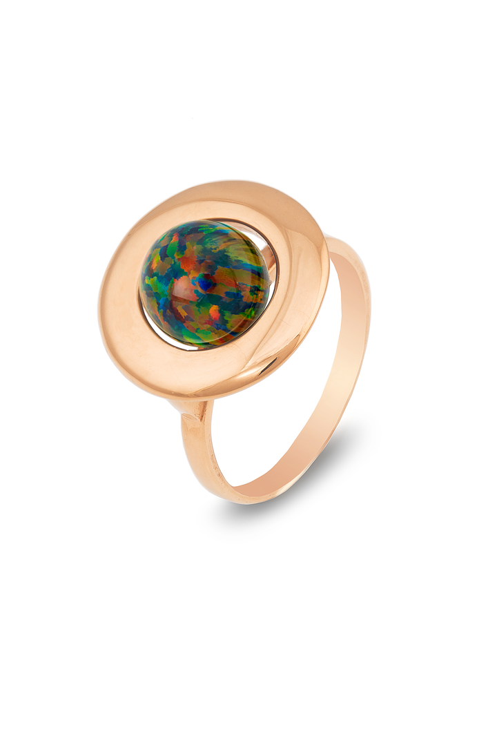 A golden ring featuring an oval-shaped, multicolored opal gemstone set in a smooth, circular bezel. The opal displays a vibrant play of colors, including shades of green, blue, and red. This elegant Home Planet Black Opal 9ct Gold ring by Cosmic Boulevard boasts a simple design with a polished finish.