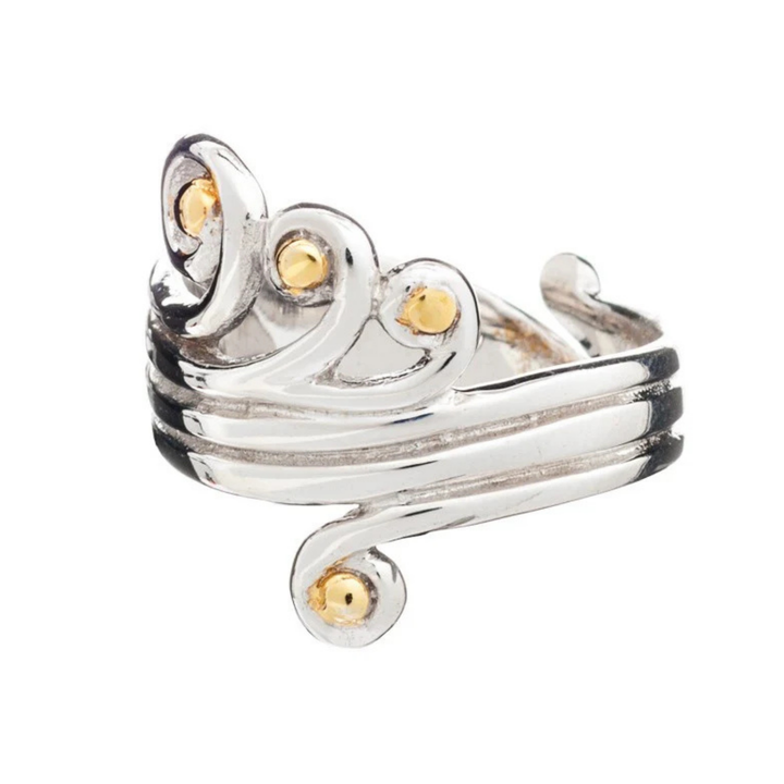A **Crown Ring** with a swirling, intricate design featuring several small, round, gold vermeil accents. The adjustable sterling silver ring by **Gallardo & Blaine Designs** showcases a blend of silver and gold elements, creating an elegant and ornate appearance.