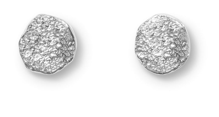 A pair of small, irregular sterling silver earrings with a textured finish, the Dublin Bay Silver Studs by Ava Jane Jewellery are handmade and displayed on a white background.