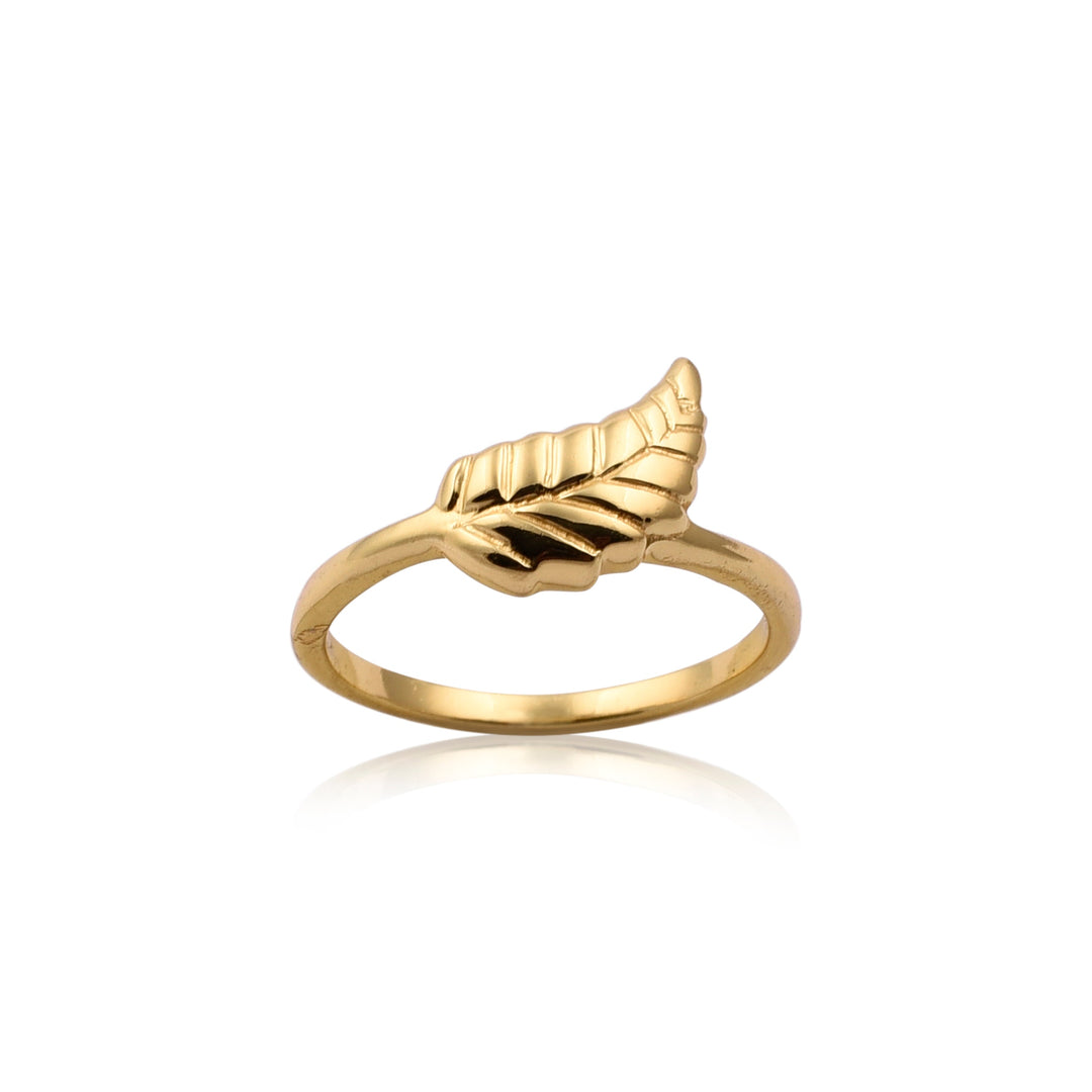 Autumn Leaf Ring by Watermelon Tropical with a leaf-shaped design on top, shown against a white background. The delicate band is smooth and polished, while the leaf features detailed texture, giving it a realistic appearance. This piece of handmade jewelry casts a faint reflection on the surface below.