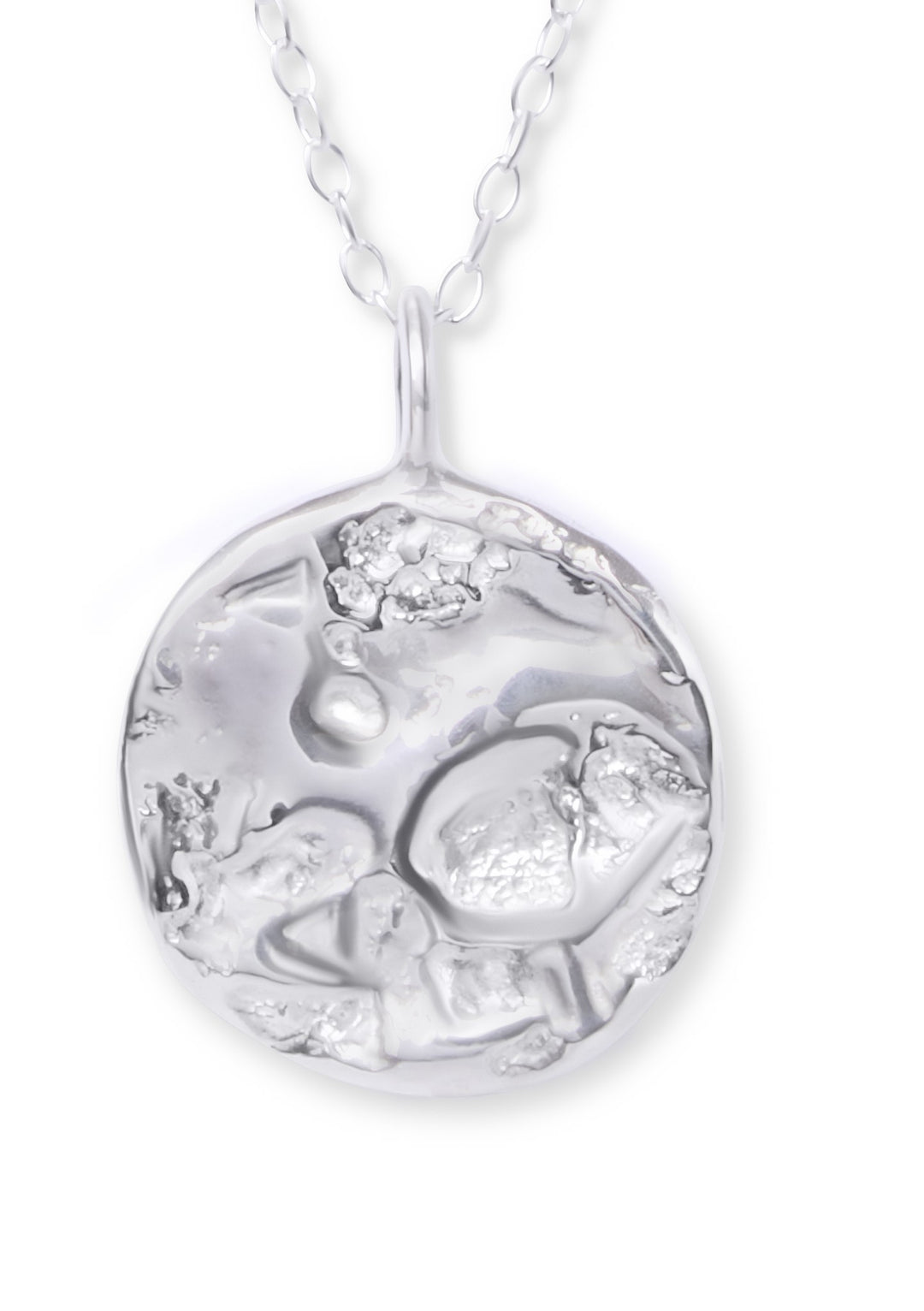The Ava Jane Jewellery Dublin Bay Silver Pendant is a handmade sterling silver necklace with an abstract, textured circular design on a delicate chain.