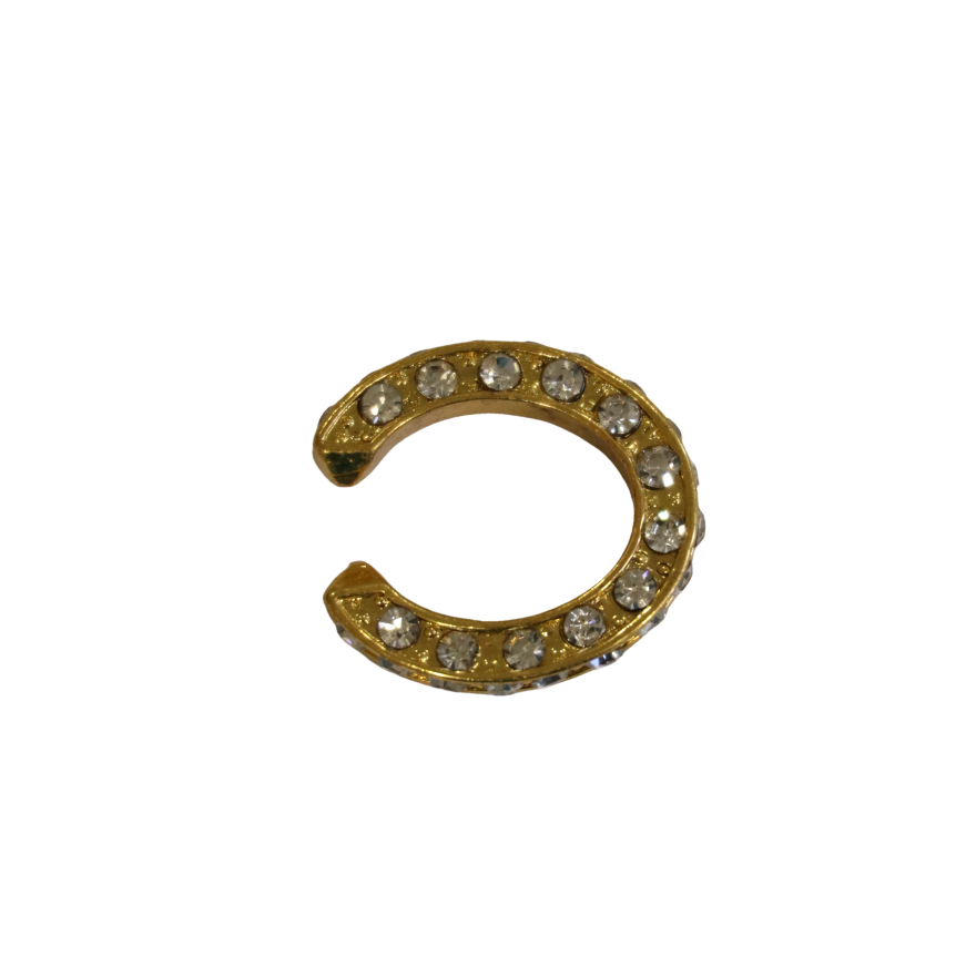 The Zubeldia Oval Crystal Gold Plated Ear Cuff shines elegantly, its gold finish and oval crystal accents sparkling against a white background.