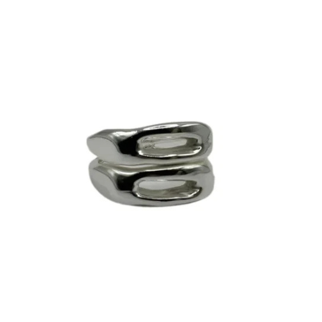The Souvenir Double Silver Ring by Inó Jewellery features an abstract, wavy design with two horizontal ovals. Handcrafted in a Dublin studio, it's shown on a plain white background.