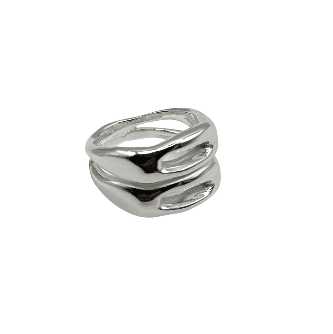 The Souvenir Double Silver Ring by Inó Jewellery showcases two thick, curved bands in a wavy, open design. This handcrafted piece from Dublin is modern and chunky, photographed against a plain white background.