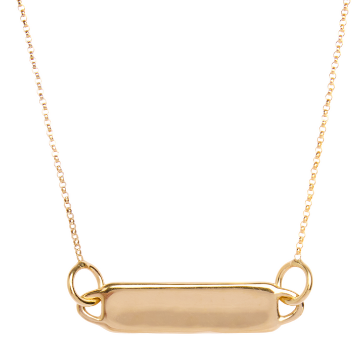 The Collective Dublin Droplet Bar Necklace features a smooth, rectangular gold pendant with two small loops on each side—ideal for engraving and personalization. The piece is showcased against a plain white background.