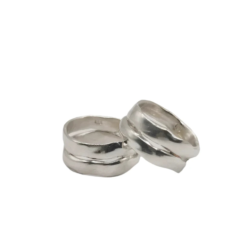 The Duo Silver Ring by Inó Jewellery features two chunky silver bands with wavy, organic textures, displayed together on a plain white background, reflecting a bold and bohemian design.