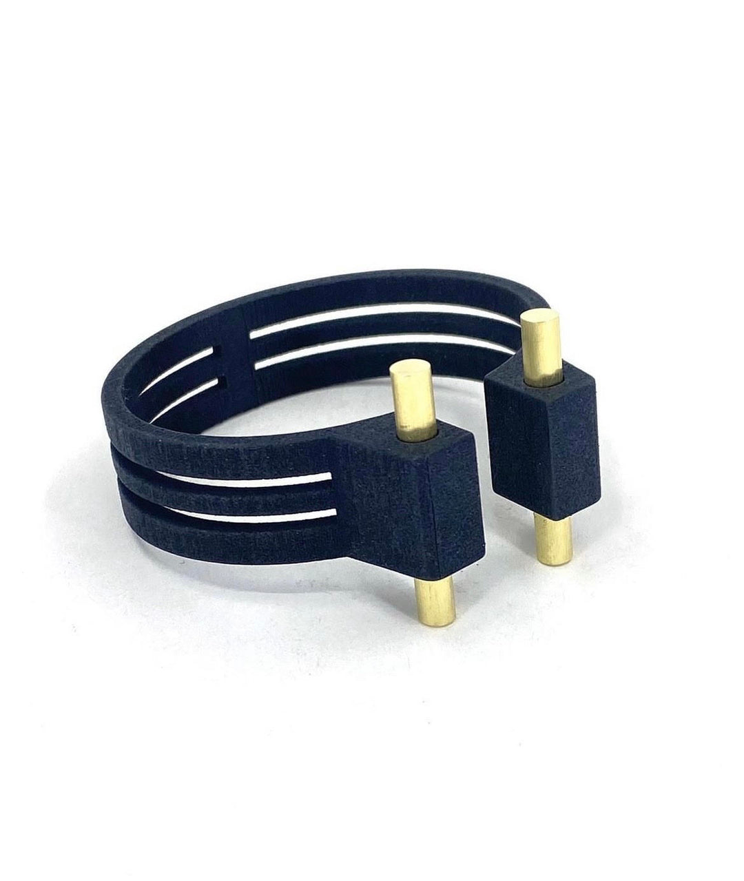 The Elsiem Rapture 2 Rod Cuff is a modern black bracelet, 3D printed in SLS Nylon, featuring three parallel bands and two lacquered brass accents at the open ends, shown on a white background.