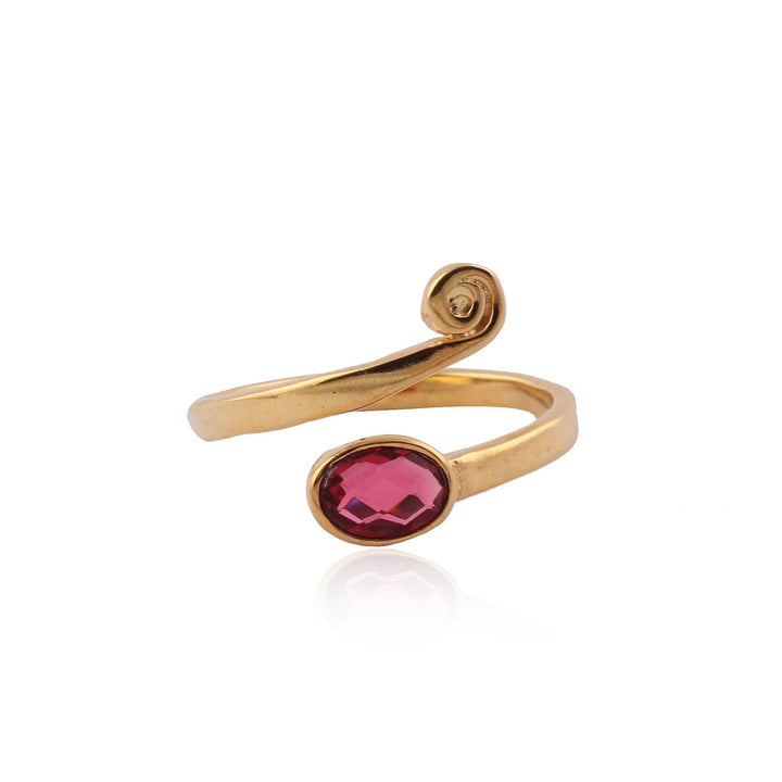 A gold-plated Evie Ring Gold Plated with Pink Quartz by Watermelon Tropical featuring an oval-shaped red gemstone as the central accent. The ring's design includes a smooth band that gracefully loops around, ending with a small coil near the gemstone. The surface is polished, reflecting a bright, shiny finish reminiscent of sterling silver.