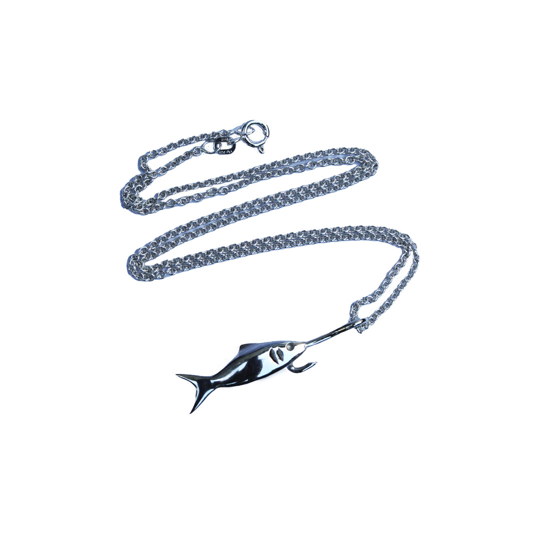 The Kate Murphy Fish On Hook Silver Pendant is a sterling silver necklace featuring a graceful fish design, elegantly displayed on a white background.