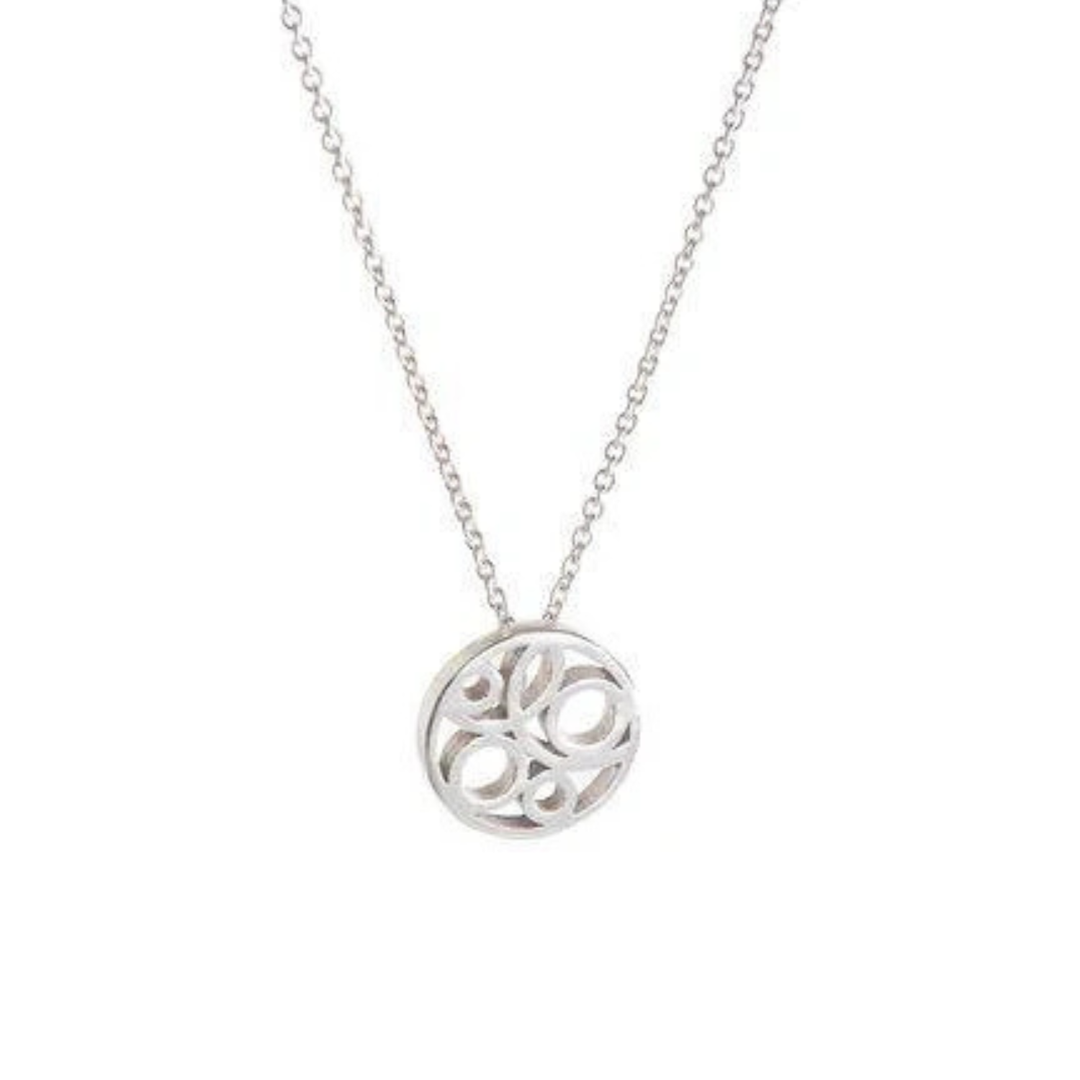 A delicate silver necklace with a dainty sterling silver pendant featuring a swirl design. The Flow Pendant Small Silver by Miriam Wade is suspended from a fine silver chain, all Irish hallmarked. The background is plain white, highlighting the necklace's intricate details.