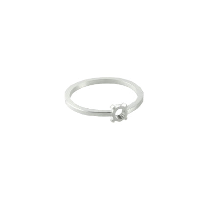 The Fruit Bijoux Minimal Ring Silver by Fruit Bijoux is a delicate sterling silver ring featuring a small gear-shaped ornament on its slim, circular band. The gear adds a unique, industrial touch to the minimalist design. The ring's brushed finish enhances its subtle sheen, making it a subtle yet distinctive accessory in the Fruit Bijoux ring tops collection.