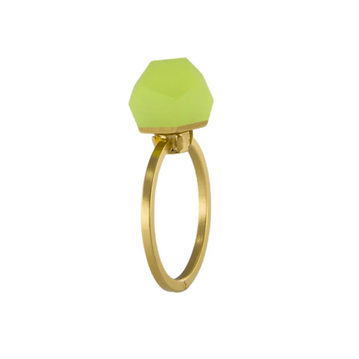 A Fruit Bijoux Fruit Bijoux Ring Top VU Crystals Neon Yellow with a geometric design featuring a matte, hexagonal green gemstone on top. The 24ct gold-plated band has a sleek, simple style that highlights the bold, modern stone.