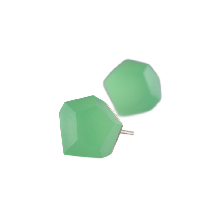 The Fruit Bijoux Stud Earrings VU Crystals Flash Green feature faceted mint green gemstones set in a minimalist 24ct gold-plated silver backing. The unique asymmetric pentagonal shape of the gemstones adds a modern, geometric touch, and the slightly angled and offset positioning completes the contemporary design.