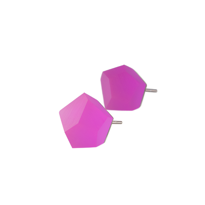 A pair of Fruit Bijoux Stud Earrings VU Crystals Magenta Pink (Silver), displaying a bright magenta pink, geometric, faceted design with metal posts, showcased against a plain white background. These modern and minimalist earrings feature angled surfaces crafted from sterling silver that beautifully reflect light.