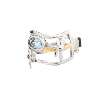 A stylish adjustable ring featuring a rectangular open-frame design in polished silver with a central blue oval gemstone and gold accents. The Small Dragonfly Ring in various gemstones by Gallardo & Blaine Designs also includes a small propeller-shaped detail on the band.