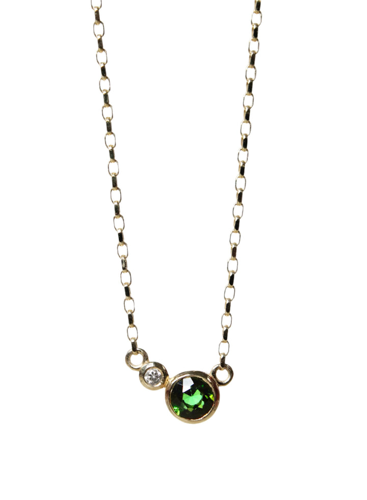 Round  green tourmaline with small round diamond bezel set in 9ct yellow gold on a 9ct yellow gold chain