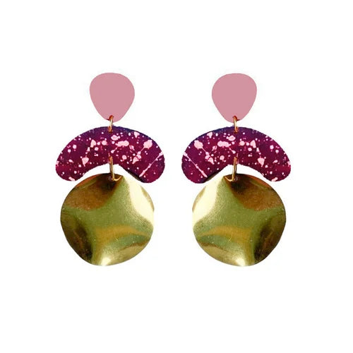The Galaxy Megadrop Earrings in Wine by Shock of Grey feature pink teardrop studs, purple speckled arches, and bold gold dangles. Each handcrafted pair comes in a recycled gift box—ideal for gifting or treating yourself.