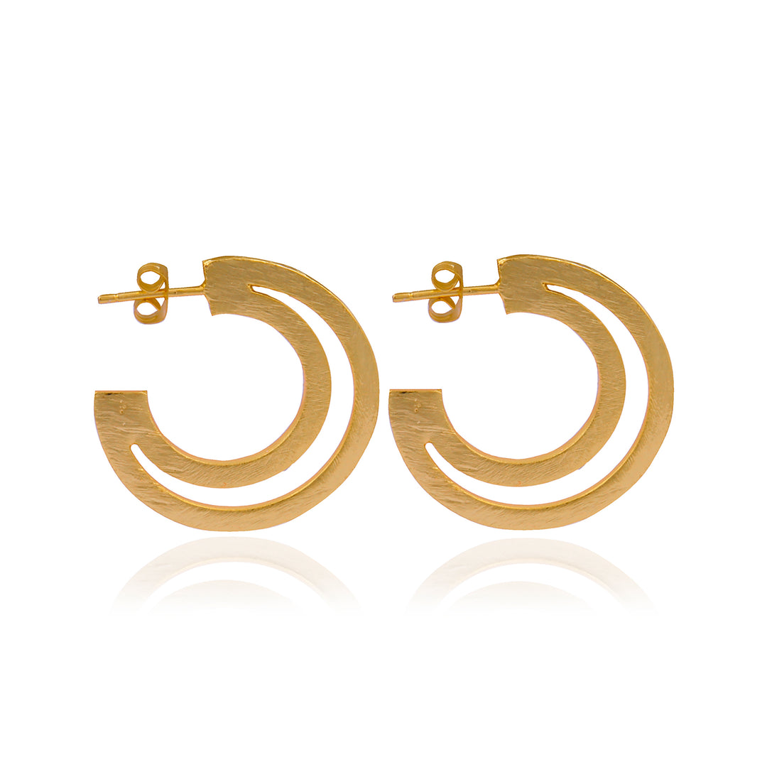 Introducing the Gigi Open Crescent Moon Earrings by Watermelon Tropical, a stunning pair of gold earrings featuring a distinctive design with a cut-out portion that creates an elegant dual arch effect. These earrings boast a textured finish and are equipped with stud backs for secure fastening. Displayed on a pristine white background, they are available in both Gold and Gold & Black variations.
