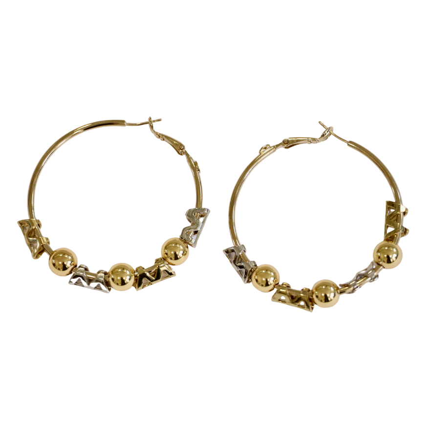 The Zubeldia Gold and Silver Hoop Earrings feature three gold-plated beads and silver zigzag accents along the bottom of each hoop, shown against a white background.