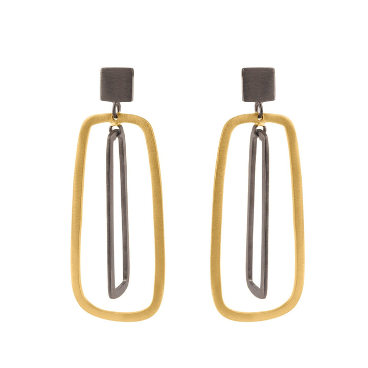 The Grafton Black & Gold Earrings by The Collective Dublin feature modern dual rectangular shapes. The outer rectangle is gold-toned, while the inner one is rhodium plated silver. This minimalistic, contemporary look is achieved with both pieces connected by small dark silver-toned links.