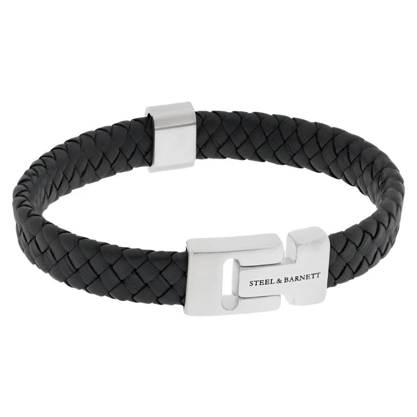 Introducing the Harrison - Black by Steel and Barnett: a sophisticated braided Nappa leather bracelet in a sleek black finish, featuring an elegant silver clasp engraved with the "STEEL & BARNETT" brand name. This stylish accessory offers a secure fastening mechanism, making it perfect for the modern professional.