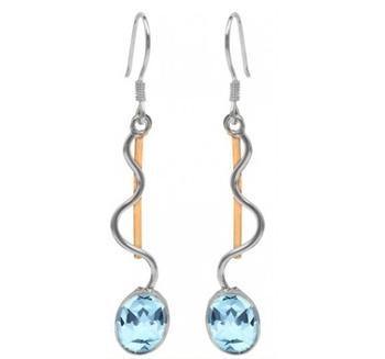 A pair of Heartbeat Earrings in various gemstones featuring an elegant design with a wavy silver and gold-plated line running parallel, resembling a heartbeat from Gallardo & Blaine Designs. At the bottom of each earring is a sparkling, oval-shaped blue gemstone. The earrings have hook-style backs for wearing.