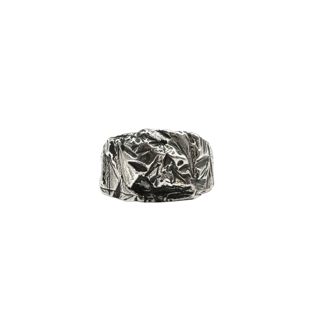 The Hephaestus Silver Ring by Inó Jewellery features a chunky, crumpled texture and rugged, uneven surface, making it a bold statement piece. Photographed against a plain white background.