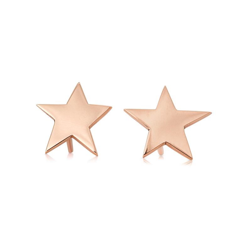 The *Delicate 9ct Gold Star Stud Earrings* by *Cosmic Boulevard*, shown in yellow gold, feature a five-point star design with a slightly reflective surface. The earrings are displayed against a white background, highlighting their front-facing sides perfectly.