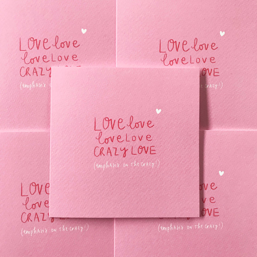 A Pickled Pompom LOVE LOVE LOVE LOVE CRAZY LOVE card, featuring an original illustration, is centered on a patterned background of similar cards. The textured card displays handwritten text in red and white: "LOVE love love love CRAZY LOVE (emphasis on the crazy)," with a small white heart above the text.