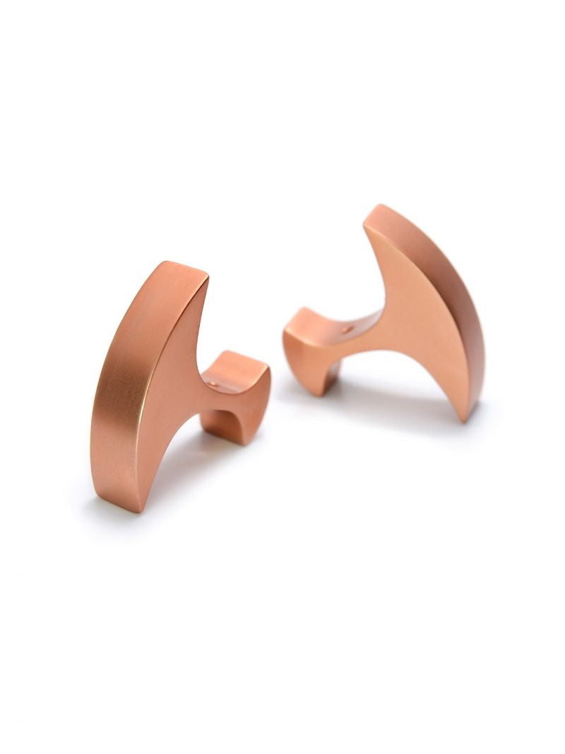 A pair of sleek, modern Secant Cufflinks crafted from anodized aluminium, featuring a unique shape that combines a curved edge with straight lines. The Secant Cufflinks by Filip Vanas are displayed against a plain white background.