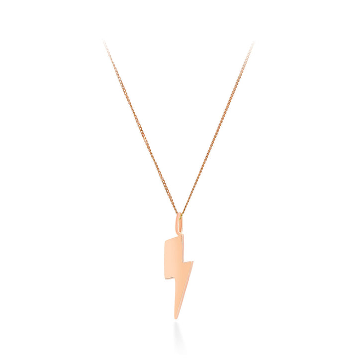 A delicate 9ct gold chain necklace by Cosmic Boulevard, featuring a sleek and minimalist Bowie Lightning Bolt Pendant in your choice of yellow or rose gold. The pendant boasts a smooth, polished surface, giving the necklace a modern and stylish look. It is elegantly displayed on a white background.