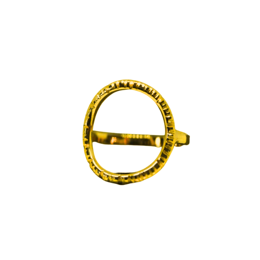 The Aud Into The Light Ring in 9ct Yellow Gold features a large open circle with textured edges and a horizontal bar, displayed against a plain white background.