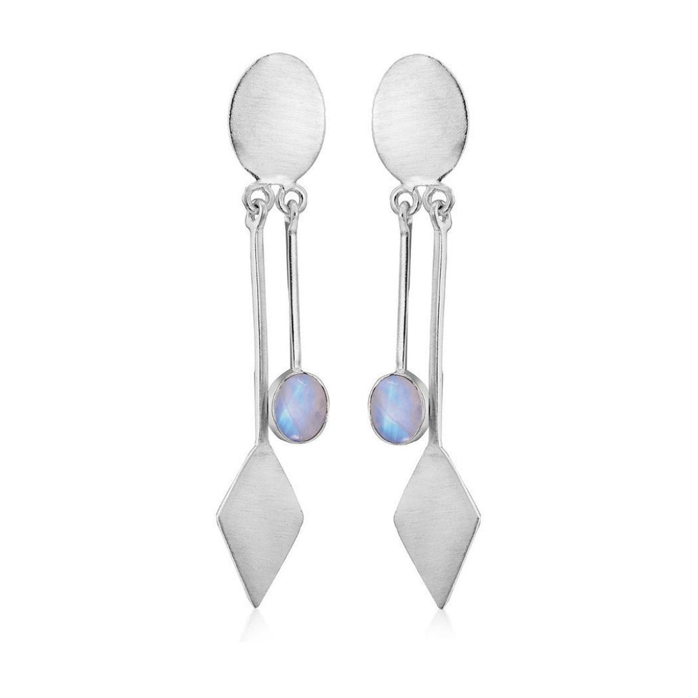 The Karo Earrings by Gallardo & Blaine Designs feature silver oval studs with geometric dangles and iridescent round gemstones, embodying modern elegance.