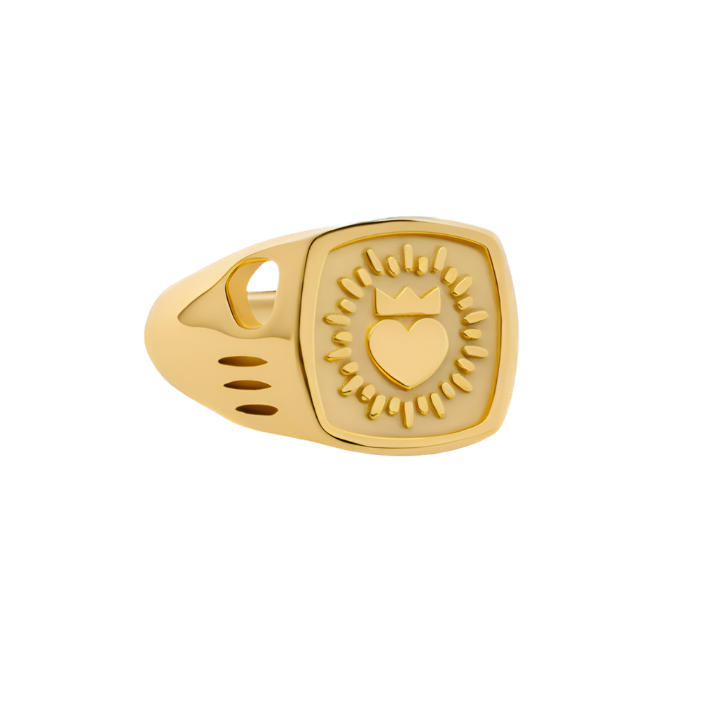 The Collective Dublin's Keith Haring Inspired Claddagh Ring features a square gold signet engraved with a crowned heart and radiating lines, blending modern Irish style with artistic flair.