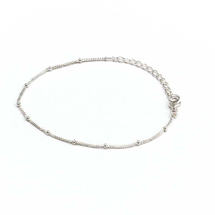 The Watermelon tropical Knot Chain Bracelet is a sterling silver anklet with evenly spaced small beads and an adjustable clasp, shown on a white background.