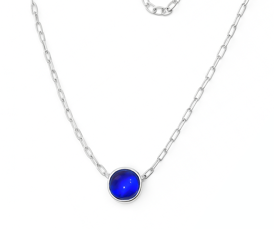 The Watermelon tropical Kyanite Quartz Drop Silver Necklace features a sterling silver chain with a round deep blue kyanite quartz pendant in a simple bezel, shown on a white background.