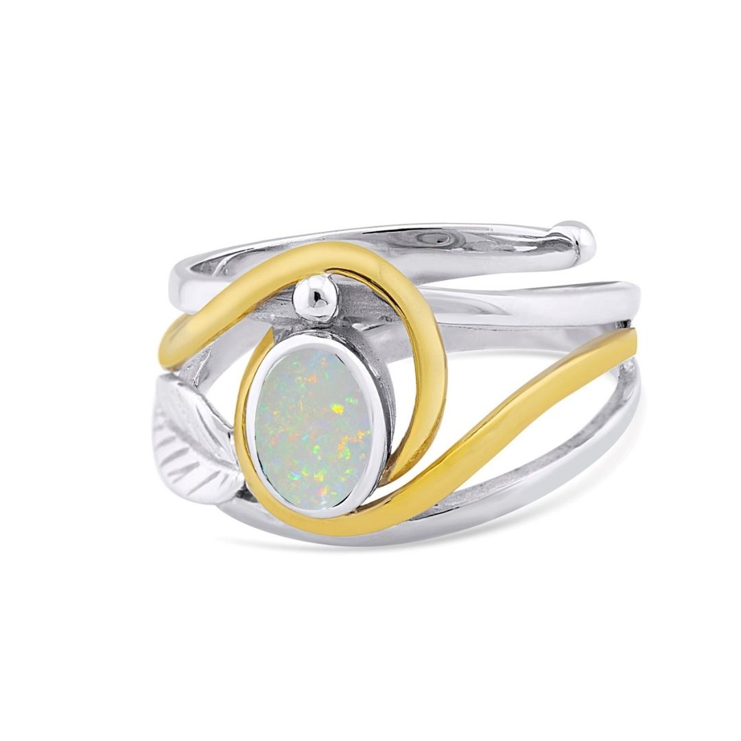 The Adjustable Leaf Ring by Gallardo & Blaine Designs features an elegant silver and gold two-tone design with an oval opal gemstone, showcasing a colorful play of light with soft, flowing curves wrapping around the vibrant gem.