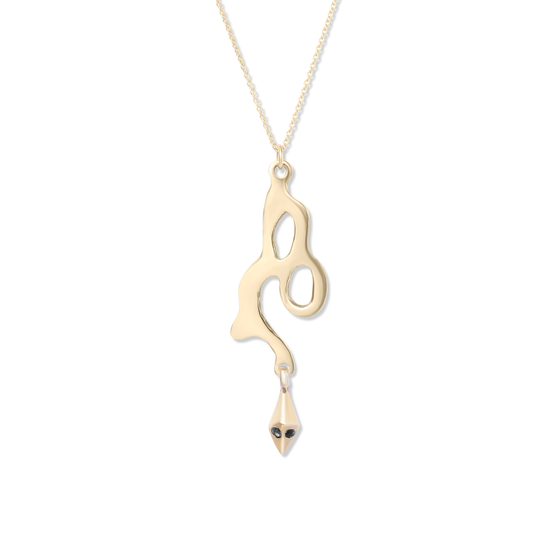 The Serpent Pendant by Madeleine Sculptural Jewellery is a gold necklace with an abstract wavy pendant, cutout shapes, a drop-shaped charm, and two dark stones—a unique piece of handmade jewellery.