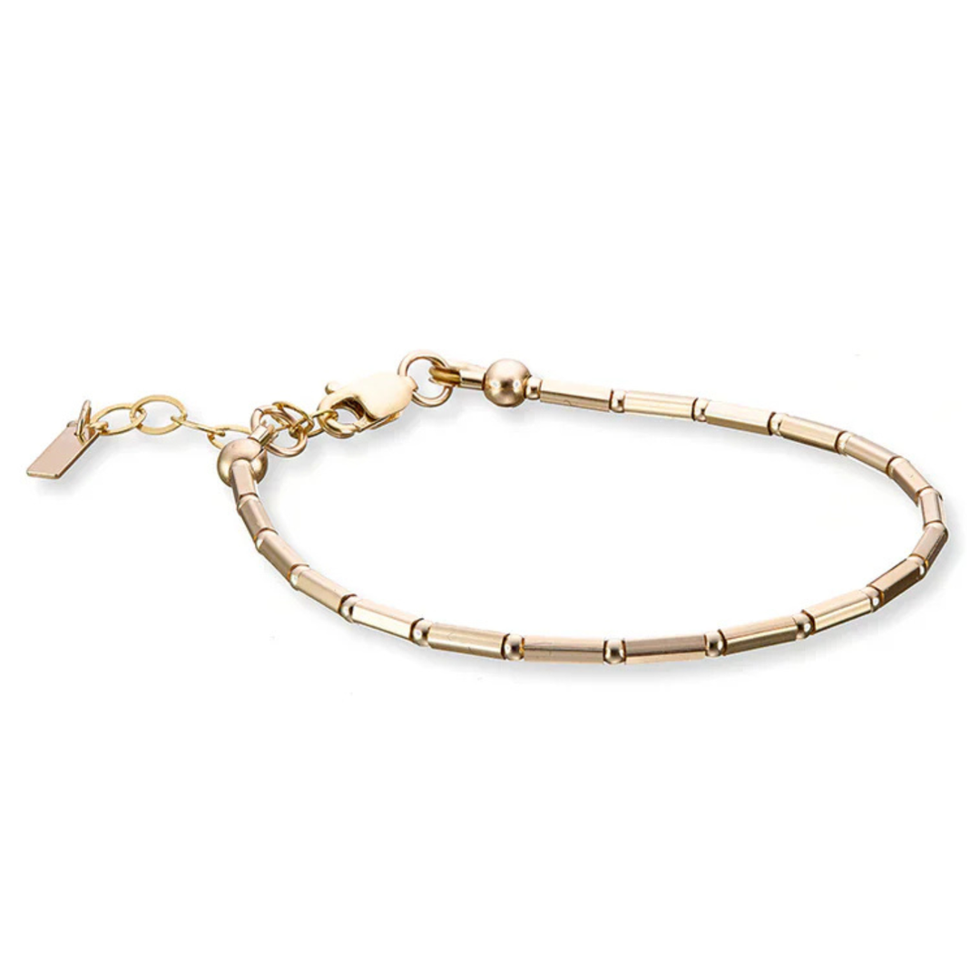 fine gold bracelet with tube style beads and an extension chain. 