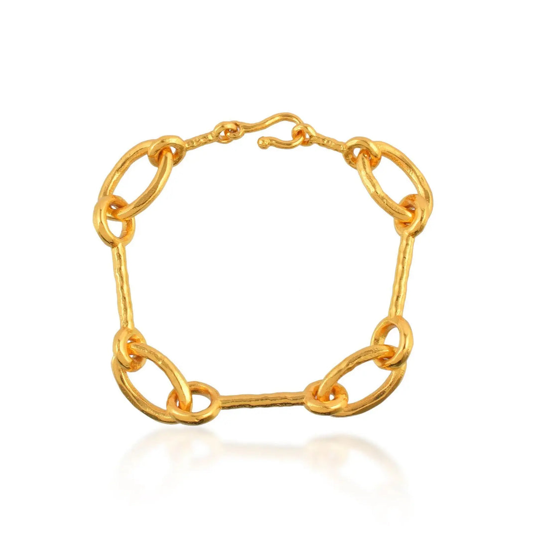 The Shyla Matera Bracelet showcases large, textured oval links and a secure hook clasp, elegantly displayed on a white background.