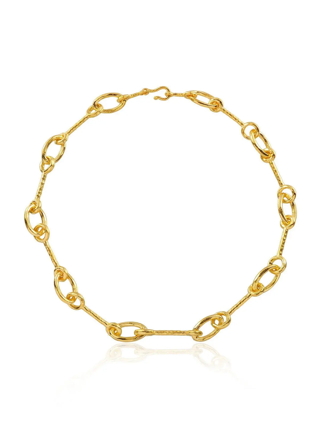 The Matera Necklace by Shyla is an elegant gold piece with large, oval-shaped links of varying sizes, a unique design, hook clasp, and polished finish. Displayed on a white background.