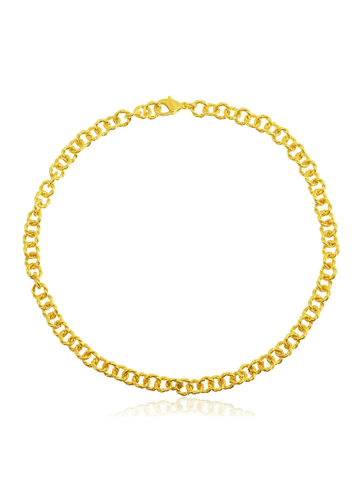 A close-up of a 22 carat gold chain necklace with a lobster clasp. The chain features interlocking round links, creating a uniform and elegant design. The statement necklace, the Mayal Gold Chain Necklace by Shyla, is displayed on a white background, highlighting its shiny and polished finish.