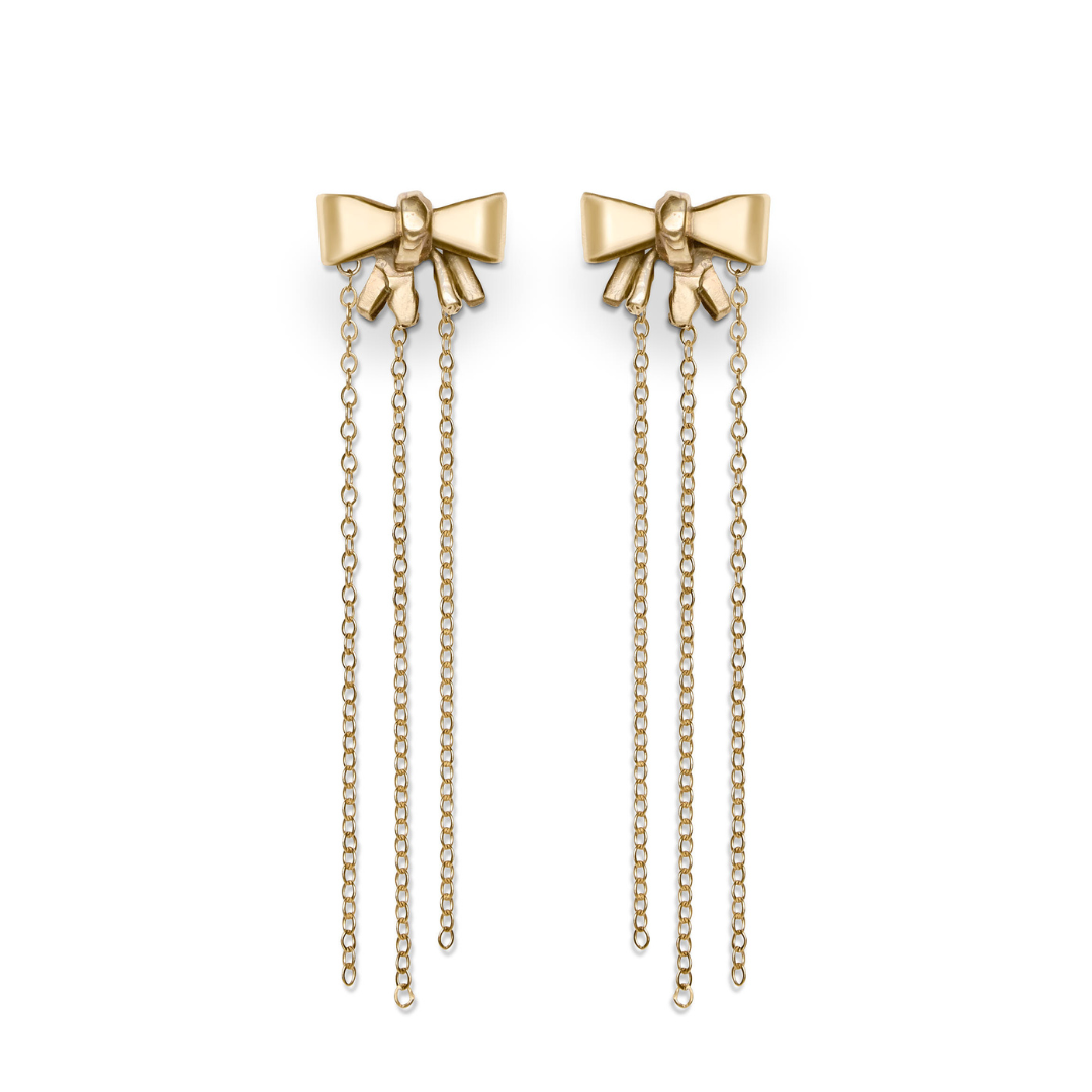 Bow earrings by Madeleine Sculptural Jewellery feature an elegant, feminine bow design with three delicate chain dangles and a polished metal finish. Crafted as sustainable jewellery, they blend style and eco-consciousness.