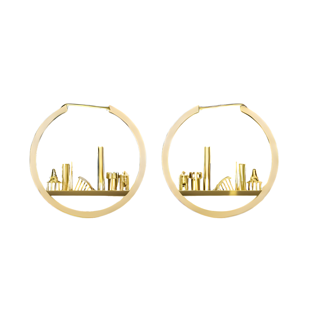 The Horizon of Dublin Hoops by Madeleine Sculptural Jewellery feature a cut-out cityscape with geometric detailing, highlighting sustainable craftsmanship and a unique handcrafted design.