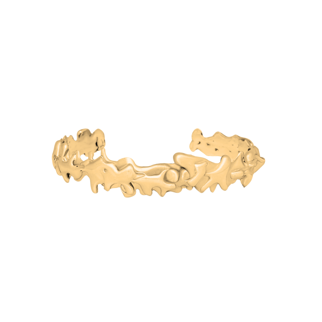 The Molten Cuff Small by Madeleine Sculptural Jewellery is a sustainable, handmade gold bracelet with an organic, textured design and wavy edges, open-back style, shown against a plain white background.