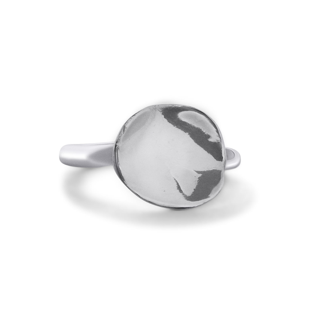 The Tide Ring by Madeleine Sculptural Jewellery features a round, highly polished, slightly domed silver disc at its center, set on a smooth and simple band.