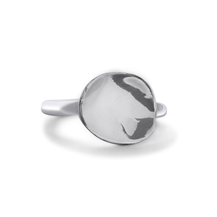 The Tide Ring by Madeleine Sculptural Jewellery features a round, highly polished, slightly domed silver disc at its center, set on a smooth and simple band.