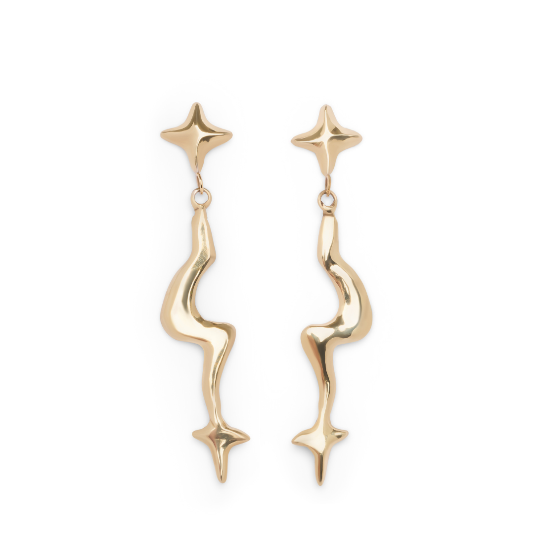 The Nova Earring Large from Madeleine Sculptural Jewellery features a shiny, polished gold finish and an abstract wavy design that connects small four-pointed stars at the top and bottom.