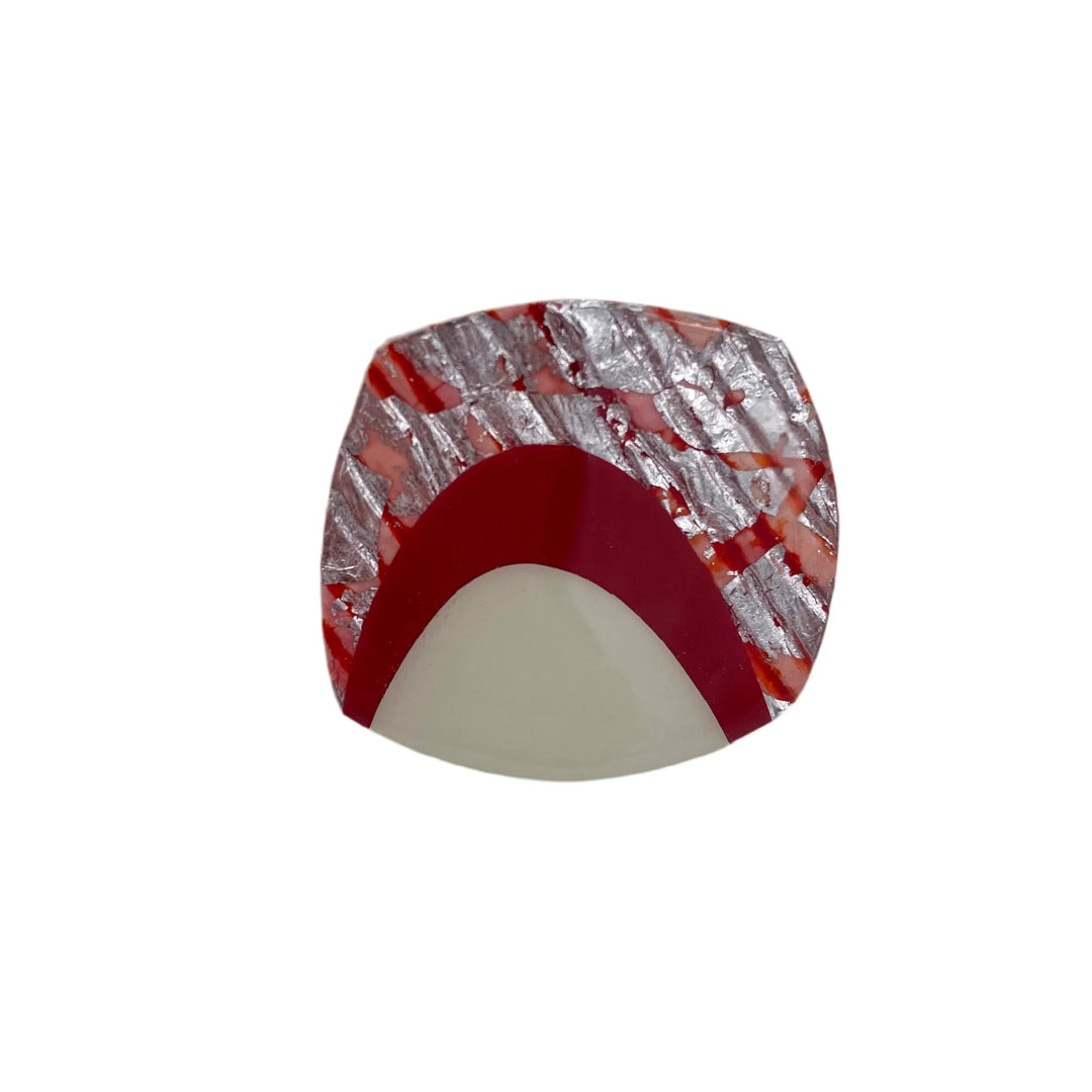 The Rothlú M'anam Cocktail Ring features a square dome design in berry, cream, coral, and silver with red arcs and silver sgraffito batik diagonal lines over a translucent red background.