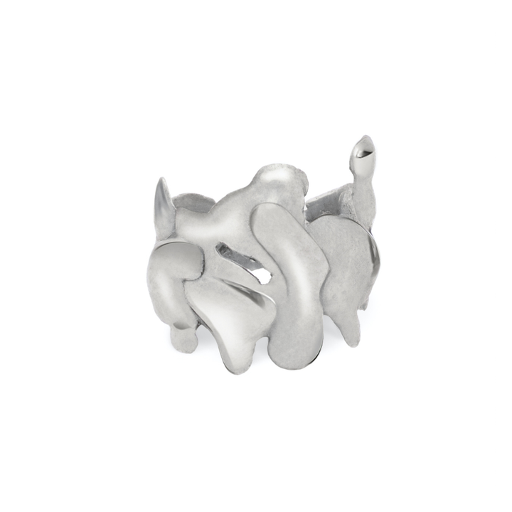The Molten Ring by Madeleine Sculptural Jewellery features a wide silver band with smooth, irregular cutouts and curved edges—an artful, handmade piece with an abstract, organic design.